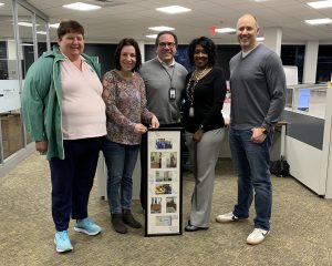 CHIP representatives presented Alonda with a long frame that included before and after photos of the transformation.