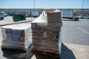 Shows food delivered to the Foodbank on pallets. 